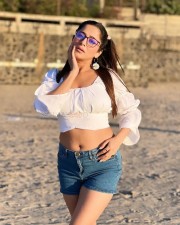 Glam Kate Sharma in a White Crop Top and Denim Shorts Photos 01