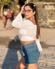 Glam Kate Sharma in a White Crop Top and Denim Shorts Photos 02