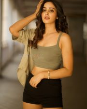 Glamorous Vithaikkaaran Actress Anaira Gupta in an Olive Green Tank Top with a Light Khaki Short Sleeved Shirt and Black High Waisted Shorts Photos 01