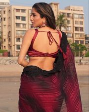Hot Kate Sharma in a Maroon Saree with Matching Sleeveless Blouse Photos 09