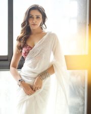 Seductive Anaira Gupta in a Sheer White Saree with a Red Sleeveless Floral Printed Blouse Pictures 02