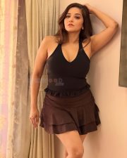 Seductive Asli Monalisa Cleavage in a Black Halter Neck Top and Brown Mini Skirt Photos 03