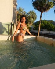 Sensuous Kate Sharma in a Two Piece Yellow High Waisted Bikini with an Orange and Green Tropical Floral Print Photos 03