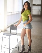 Sexy Anaira Gupta in a Green Top and Denim Shorts Photos 02