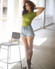 Sexy Anaira Gupta in a Green Top and Denim Shorts Photos 07