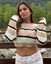 Trendsetting Actress Kate Sharma in a Striped Knit Crop Sweater Photos 01