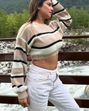 Trendsetting Actress Kate Sharma in a Striped Knit Crop Sweater Photos 02