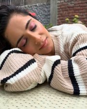 Trendsetting Actress Kate Sharma in a Striped Knit Crop Sweater Photos 03
