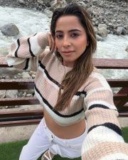 Trendsetting Actress Kate Sharma in a Striped Knit Crop Sweater Photos 04