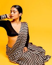 3BHK Actress Chaithra J Achar in a Striped Black and White Saree with a Deep Cut Long Sleeve Blouse Photos 01