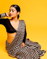 3BHK Actress Chaithra J Achar in a Striped Black and White Saree with a Deep Cut Long Sleeve Blouse Photos 01