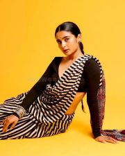 3BHK Actress Chaithra J Achar in a Striped Black and White Saree with a Deep Cut Long Sleeve Blouse Photos 02