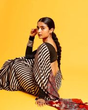 3BHK Actress Chaithra J Achar in a Striped Black and White Saree with a Deep Cut Long Sleeve Blouse Photos 03