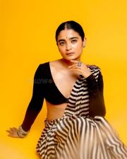 3BHK Actress Chaithra J Achar in a Striped Black and White Saree with a Deep Cut Long Sleeve Blouse Photos 07