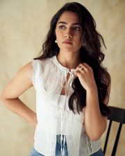 Ace Heroine Rukmini Vasanth in a White Chic Sleeveless Top and Denim Pant Photos 01