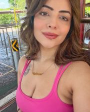 Alluring Aanchal Munjal Cleavage in a Pink Crop Top and White Pleated Mini Skirt Photos 03