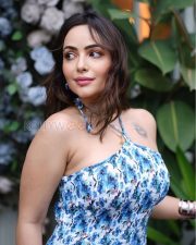 Alluring Actress Aanchal Munjal in a Blue Floral Halter Neck Dress Photos 01