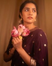 Charming Actress Rukmini Vasanth in a Retro Purple and Orange Outfit with a Pink Lotus Photos 02