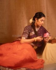 Charming Actress Rukmini Vasanth in a Retro Purple and Orange Outfit with a Pink Lotus Photos 03