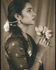Charming Actress Rukmini Vasanth in a Retro Purple and Orange Outfit with a Pink Lotus Photos 04