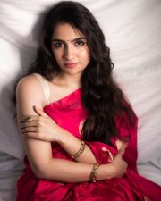 Elegant Rukmini Vasanth in a Red Saree with a Cream Sleeveless Blouse Photos 02