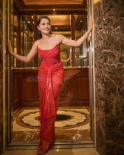 Radiant Actress Rukmini Vasanth in a Red Sequin Strapless Saree Photos 02