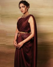 Regal Actress Rukmini Vasanth in a Dark Maroon One Shoulder Draped Saree Photos 03