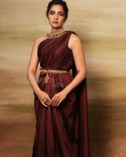 Regal Actress Rukmini Vasanth in a Dark Maroon One Shoulder Draped Saree Photos 04