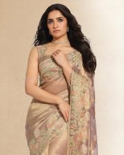 Rising Style Icon Rukmini Vasanth in a Beige Sheer Saree with Matching Sleeveless Blouse Pictures 01
