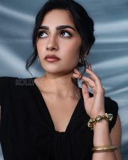Sophisticated Actress Rukmini Vasanth in a Black Sleeveless Bow Dress Photos 04