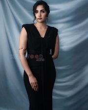 Sophisticated Actress Rukmini Vasanth in a Black Sleeveless V Neck Tie Front Maxi Dress Gold Bangles Photos 01