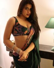 Attractive Nikita Sharma in a Black Flowing Floral Printed Saree with a Matching Sleeveless Printed Crop Top Blouse Pictures 05