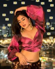 Attractive Nikita Sharma in a Magenta and Pink Floral Printed Crop Top with Puff Sleeves and High Waisted Black Maxi Skirt Pictures 02