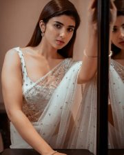 Baby and Baby Actress Pragya Nagra in a White Sheer Saree with Matching White Sleeveless Blouse Pictures 01