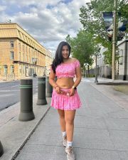 Beautiful Indian Beauty Nikita Sharma Navel in a Pink Mini Skirt and Crop Top Photos 03