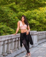 Beautiful Nikita Sharma in a Light Pink Sports Bra and Black Leggings Photos 01