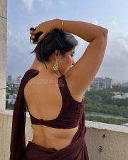 Big Beauty Nikita Sharma in a Maroon Saree with Sleeveless Blouse Photos 01
