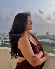 Big Beauty Nikita Sharma in a Maroon Saree with Sleeveless Blouse Photos 03