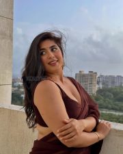 Big Beauty Nikita Sharma in a Maroon Saree with Sleeveless Blouse Photos 04