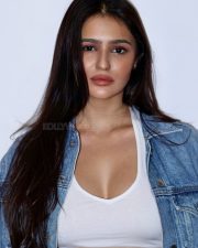 Bold Actress Prakriti Pavani in a White Crop Top and Denim Jacket Photos 01