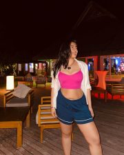Bold Nikita Sharma in a Pink Tank Top and Blue Shorts Photos 03