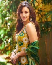 Delightful Actress Tripti Dimri in a Yellow Green Ikat Printed Anarkali Photos 02