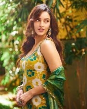 Delightful Actress Tripti Dimri in a Yellow Green Ikat Printed Anarkali Photos 03