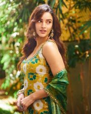 Delightful Actress Tripti Dimri in a Yellow Green Ikat Printed Anarkali Photos 03