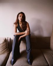 Desirable Actress Triptii Dimri in a Charcoal Pinstripe Halter Neck Vest with a High Waisted Wide Leg Trousers Photos 01