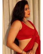 Desirable Nikita Sharma in a Red Sheer Saree with a Matching Red Sleeveless Blouse Pictures 02