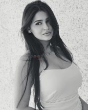 Elegant Actress Prakriti Pavani in a white off shoulder crop top with white sheer skirt photos 02