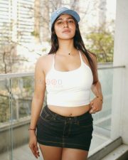Fashionable Actress Prakriti Pavani in a White Crop Top and Denim Shorts Photos 05