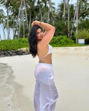 Glam Nikita Sharma in a White Bra and Transparent Pants at the Beachside Photos 02