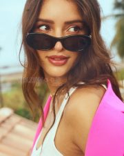Luminous Actress Tripti Dimri in a Hot Pink Blazer and White Top with Miu Miu Sunglasses Photos 02